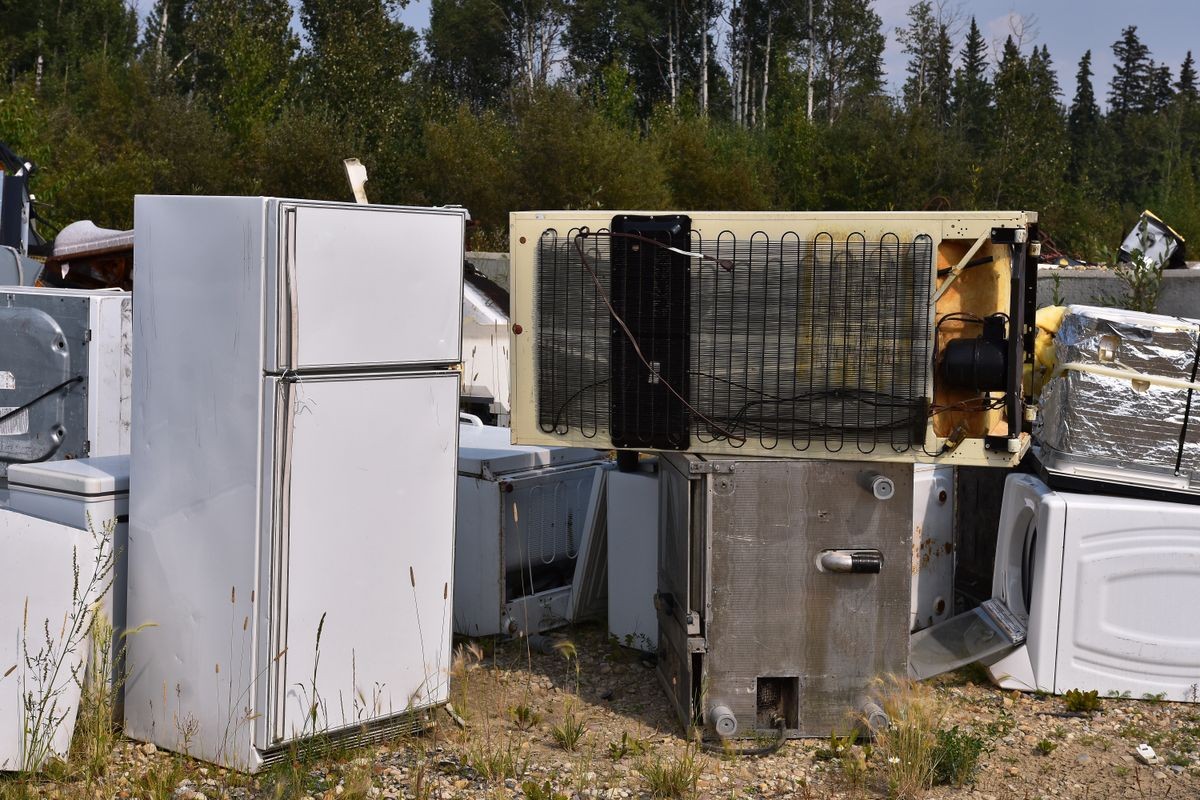 An image of old used appliances at a recycling facility. 